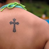 Lower_back_cross_tattoos_for_women_1