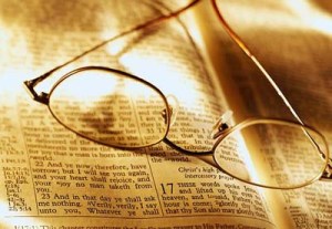 Glasses on Open Bible